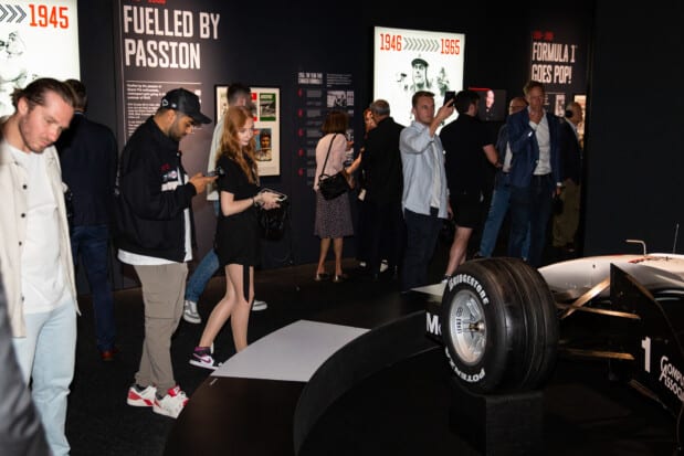 Several visitors to the F1 exhibition in Amsterdam gathered around the one formula 1 car.